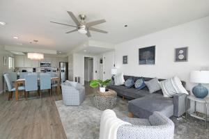 a living room with a couch and a dining room at Bayside Walk Escape Unit A in San Diego