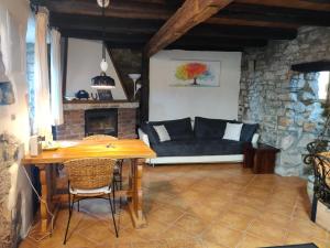 a living room with a couch and a table at Villa Luna in Veprinac