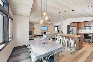 a dining room and kitchen with a table and chairs at Arrowhead Adventures in South Lake Tahoe