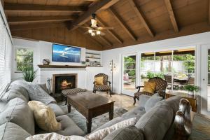 a living room with a couch and a fireplace at Ludington Haven in San Diego