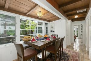 a dining room with a wooden table and chairs at Ludington Haven in San Diego