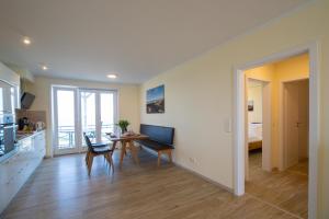 Posezení v ubytování Weiße Düne Ferienwohnung *Weiße Düne 6* + 13 fotografií