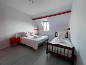 Posteľ alebo postele v izbe v ubytovaní Gîte Gold - La Ferme Delaunay