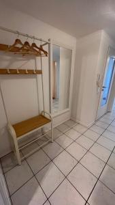 a room with a bunk bed and a tiled floor at Apartment near Europa-Park & Black Forest in Kappel-Grafenhausen