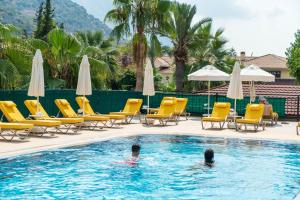 two people in the swimming pool at a resort at Sundia By Liberty Oludeniz in Oludeniz