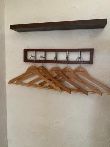 a rack of skis hanging on a wall at ゲストハウス303 in Zamami