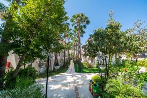 a street in a neighborhood with palm trees at Sundia By Liberty Oludeniz in Oludeniz