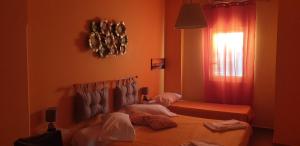 Postel nebo postele na pokoji v ubytování Oasi B&B