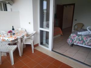 Posteľ alebo postele v izbe v ubytovaní Residence Le Rose