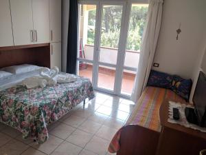 Posteľ alebo postele v izbe v ubytovaní Residence Le Rose