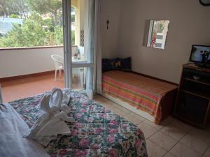 Posteľ alebo postele v izbe v ubytovaní Residence Le Rose