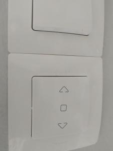 an electronic device with three arrows on the side of it at Lion house Vrachati in Vrachati