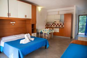 Posteľ alebo postele v izbe v ubytovaní Residence Le Rose