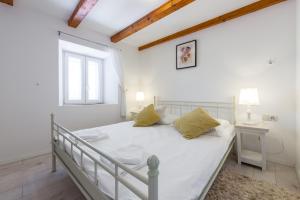 Posteľ alebo postele v izbe v ubytovaní Villa Lizza