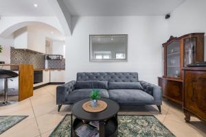 a living room with a couch and a table at Villa Lizza in Cavtat