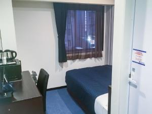 Postelja oz. postelje v sobi nastanitve HOTEL LiVEMAX Yokkaichi Ekimae