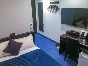 Postelja oz. postelje v sobi nastanitve HOTEL LiVEMAX Yokkaichi Ekimae