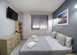 Ein Bett oder Betten in einem Zimmer der Unterkunft Excess Pansion