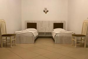 A bed or beds in a room at Kompleksi Jakaj