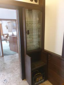 a glass cabinet with dishes in it in a room at Haus am Bach in Bad Wörishofen