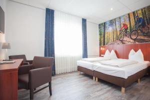 Hotel Winterberg Resort tesisinde bir odada yatak veya yataklar