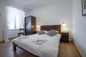 Posteľ alebo postele v izbe v ubytovaní Villa Lizza