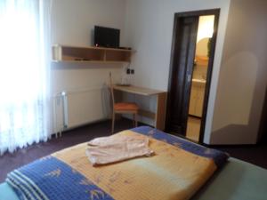 Кровать или кровати в номере Penzion v Budech