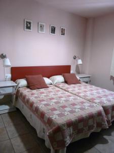 Postel nebo postele na pokoji v ubytování B&B Ra Tenaja