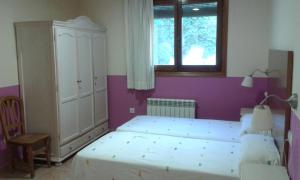 Postel nebo postele na pokoji v ubytování B&B Ra Tenaja