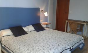 Postel nebo postele na pokoji v ubytování B&B Ra Tenaja