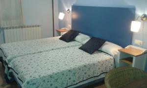 Postel nebo postele na pokoji v ubytování B&B Ra Tenaja