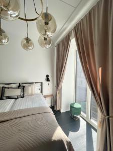 Postel nebo postele na pokoji v ubytování VH Apartments Reimani