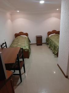 Postel nebo postele na pokoji v ubytování NarVar Hotel