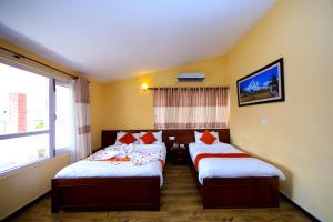Postel nebo postele na pokoji v ubytování Sampada Garden Resort