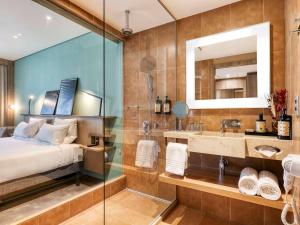 Cama ou camas em um quarto em Novotel BH Savassi