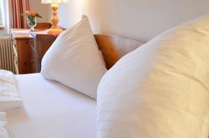 Letto o letti in una camera di Bräugasthof Hallstatt