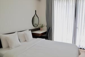Postel nebo postele na pokoji v ubytování Hoang Loc Villa