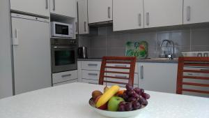 a bowl of fruit on a table in a kitchen at StaynFeel 01 in Fátima
