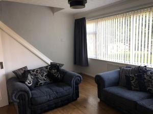 A seating area at Ainsdale Gardens