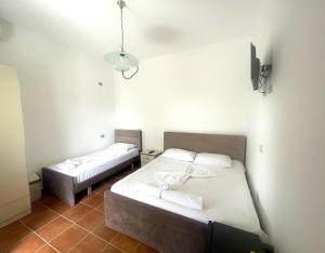 Uma cama ou camas num quarto em Hotel Athina
