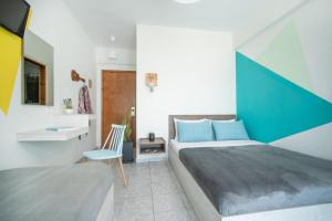 Postel nebo postele na pokoji v ubytování Hotel Astro