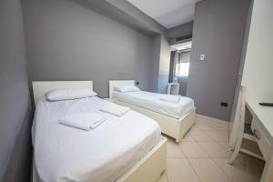Postel nebo postele na pokoji v ubytování Hotel Tosi