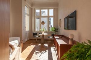 a living room with a couch and a table at Wyspa 12 in Poznań