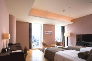 Postel nebo postele na pokoji v ubytování Hotel Arc Riche Toyohashi