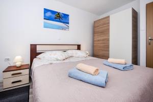 Łóżko lub łóżka w pokoju w obiekcie Casa Marin