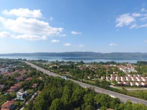 an aerial view of a town with a road and a lake at SAPANCA ALHARRAN VILLA in Sapanca