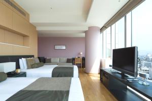 Postel nebo postele na pokoji v ubytování Hotel Arc Riche Toyohashi