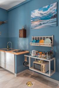 A kitchen or kitchenette at Pesce Palla Affittacamere
