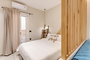 Postel nebo postele na pokoji v ubytování Argento urban apartment (sphere)