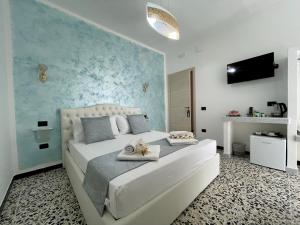 Posteľ alebo postele v izbe v ubytovaní B&B Poesia
